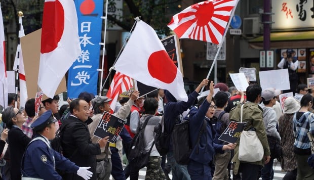 Abe’s plan to admit foreign workers draws ‘Japan First’ backlash