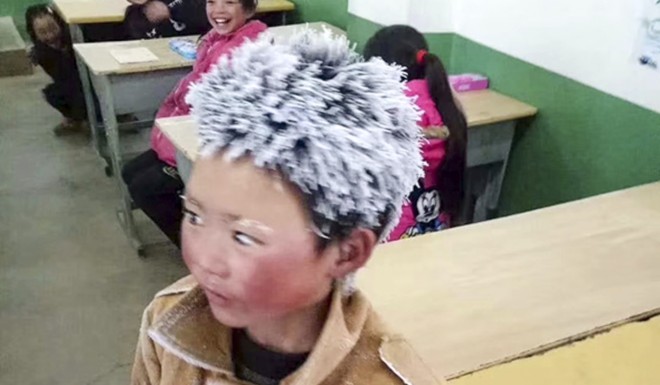 The picture of Wang Fuman's hair encrusted by ice came to symbolize the plight of millions of China's poorest children.