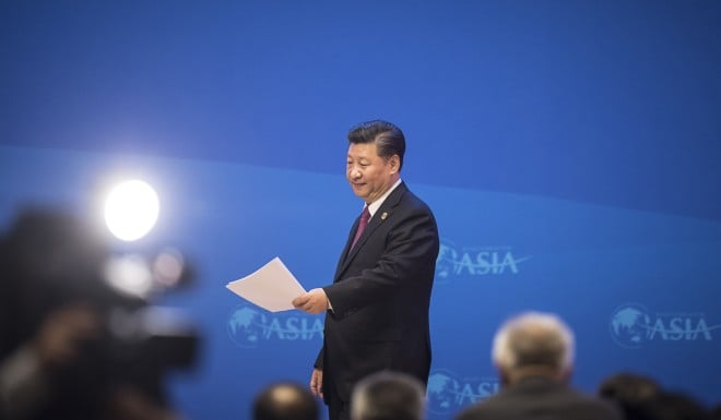 Xi Jinping walks off the stage after completing his keynote speech.