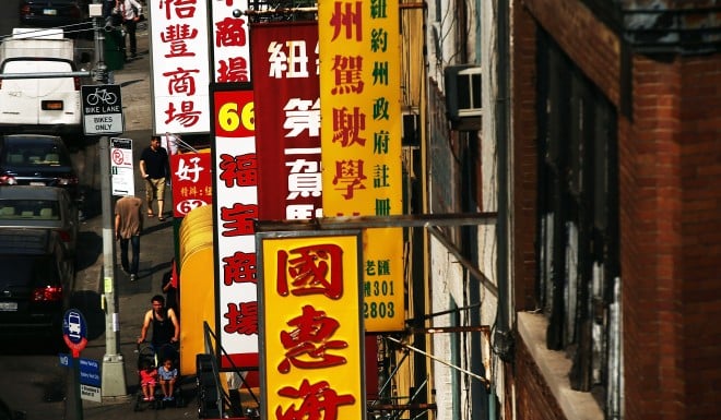 Shop signs written in traditional characters can be found in the Chinatown in New York City.