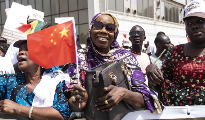 Senegal residents welcome Xi Jinping in capital city Dakar after the Chinese president arrives on July 21. 