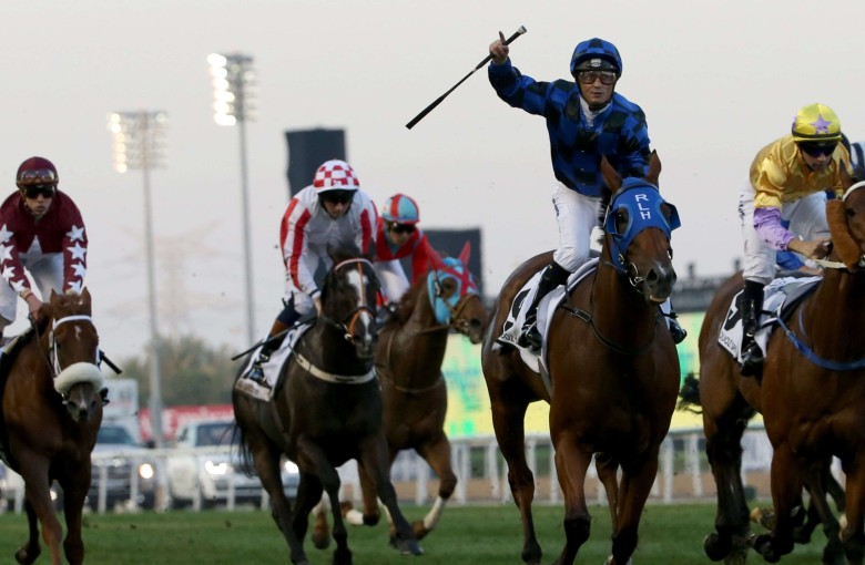 Damian Browne celebrates after leading Buffering to win the Al-Quoz Sprint during the Dubai World Cup meeting. Photo: AFP