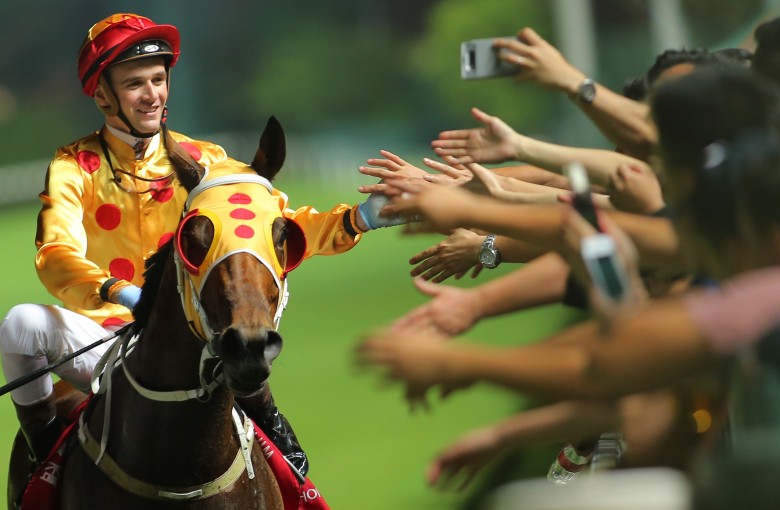 Sam Clipperton celebrates Gold Land’s win with the fans. Photos: Kenneth Chan