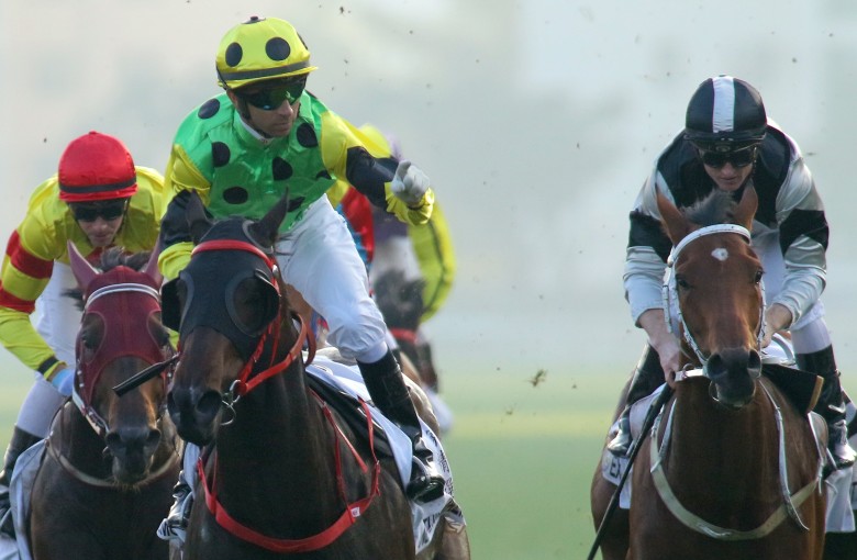 Joao Moreira celebrates winning the Hong Kong Classic Mile with Nothingilikemore. Photos: Kenneth Chan