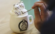 Leo Chau creates 3D latte kittens at his cafe in Admiralty. Photo: Xiaomei Chen