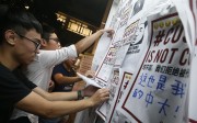 Members of Chinese University of Hong Kong's student union remove posters. Photo: K. Y. Cheng