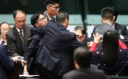 Lawmaker Eddie Chu Hoi-dick being carried out of the Legco chamber. Photo: Felix Wong