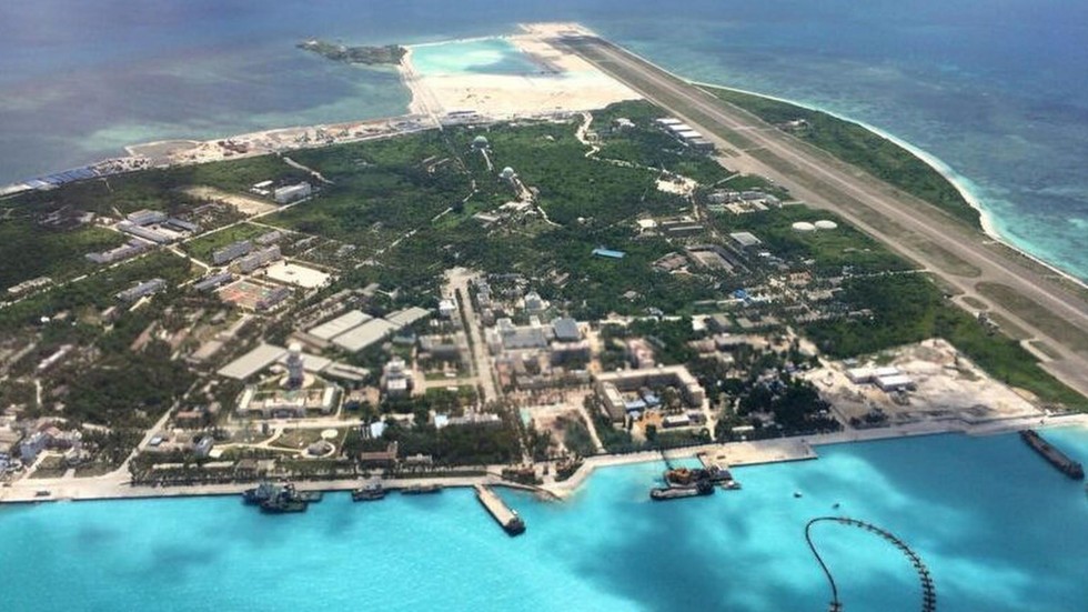 china sends warning with release of photographs of disputed south