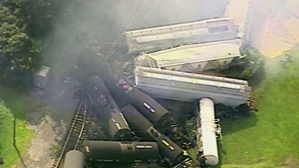 Train carrying hazardous material derails and catches fire in