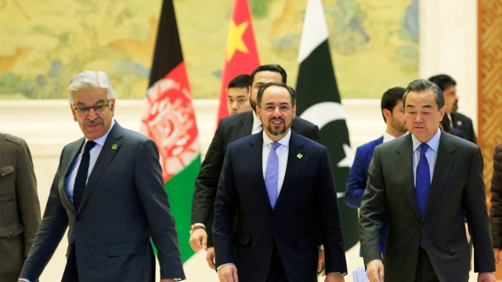 China’s Foreign Minister Wang Yi (right) pictured during his meeting with his Pakistani and Afghan counterparts, Khawaja Asif (left) and Salahuddin Rabbani (centre) at a news conference in Beijing last month. Photo: Reuters