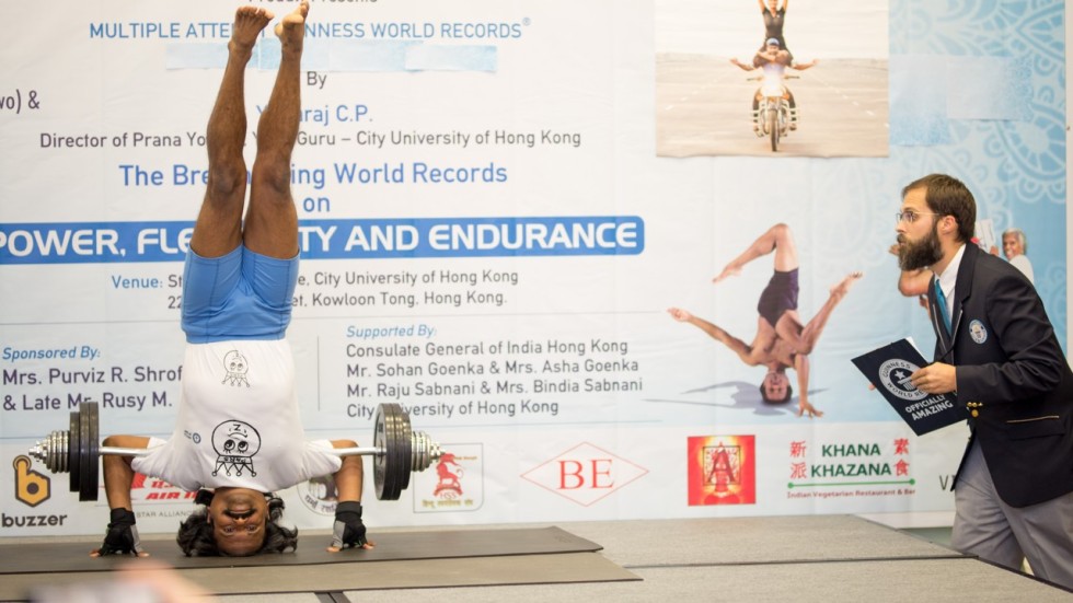 Hong Kong yogi breaks Guinness World Records for headstand and human