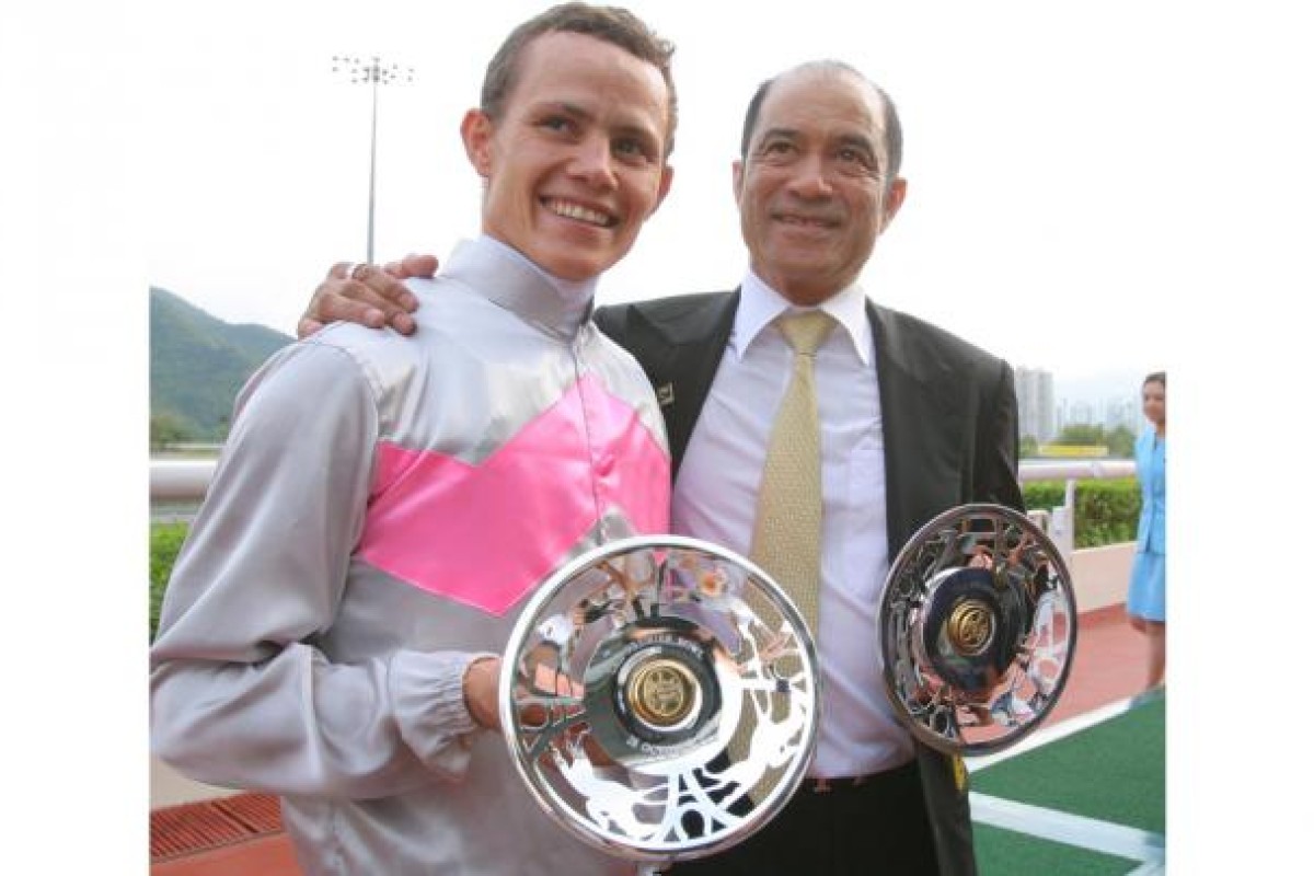 Richard Fourie and Derek Cruz savour their silverware.