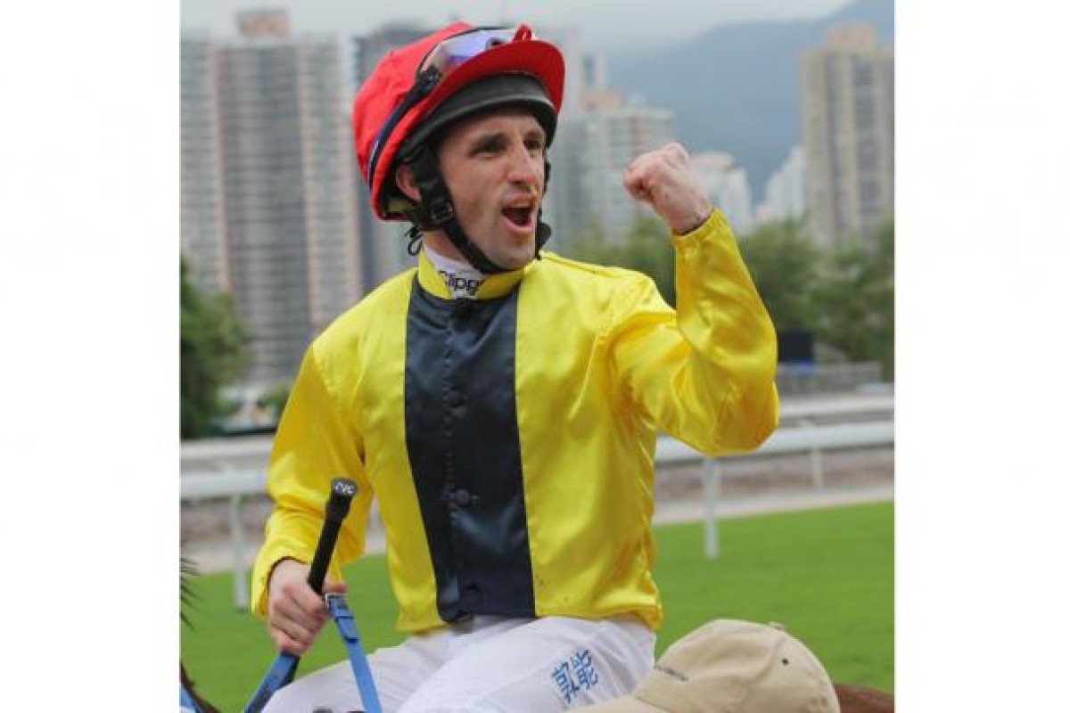 Neil Callan pumps his fist after winning on Chater D'Cat.