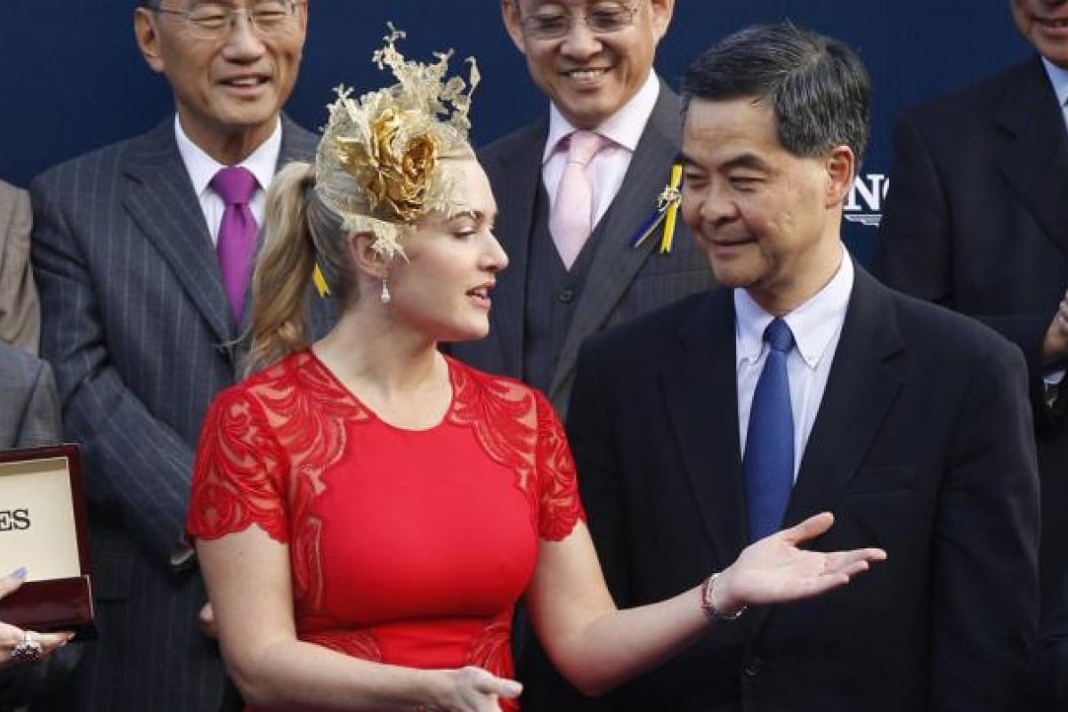 Titanic star Kate Winslet chats with HK Chief Executive CY Leung ahead of presenting the Cup to Matthew Chadwick.