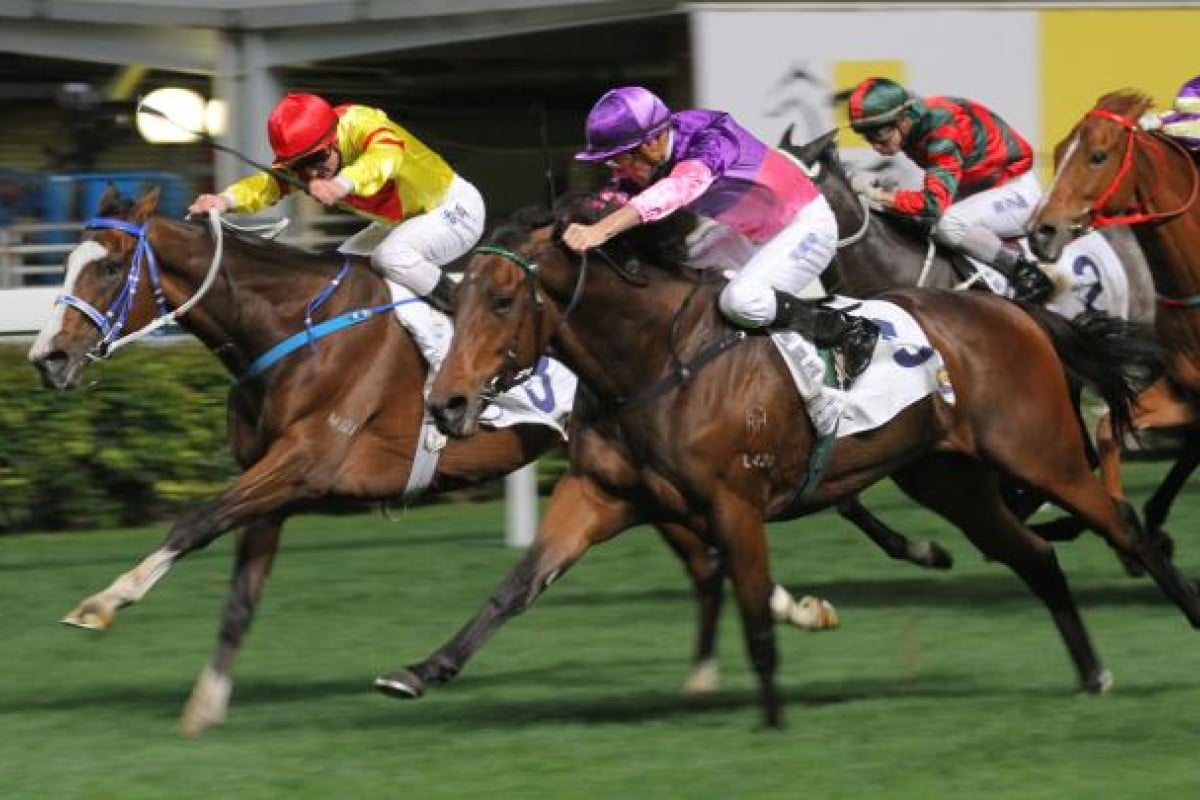 Victor Delight and Zac Purton (inside) stretch ahead of Wrath of Fire to win race seven and seal a double for the jockey. Photo: Kenneth Chan