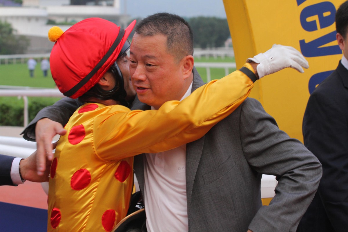 Pan Sutong congratulates Olivier Doleuze after he finally delivered a first win for Gold-Fun's owner with the National Day Cup. Photo: Kenneth Chan