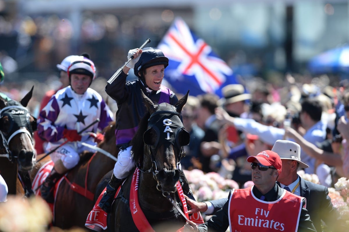 Damien Oliver celebrates his win. Photo: EPA