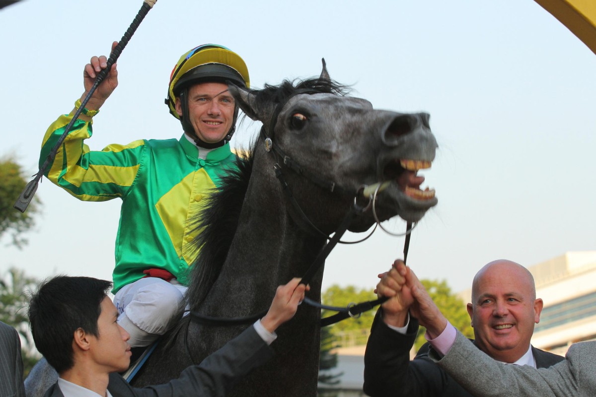 Lord Sinclair (Brett Prebble) acts up in the winner's circle after saluting in the Peninsula Golden Jubilee Challenge Cup at Sha Tin Sunday. Photo: Kenneth Chan
