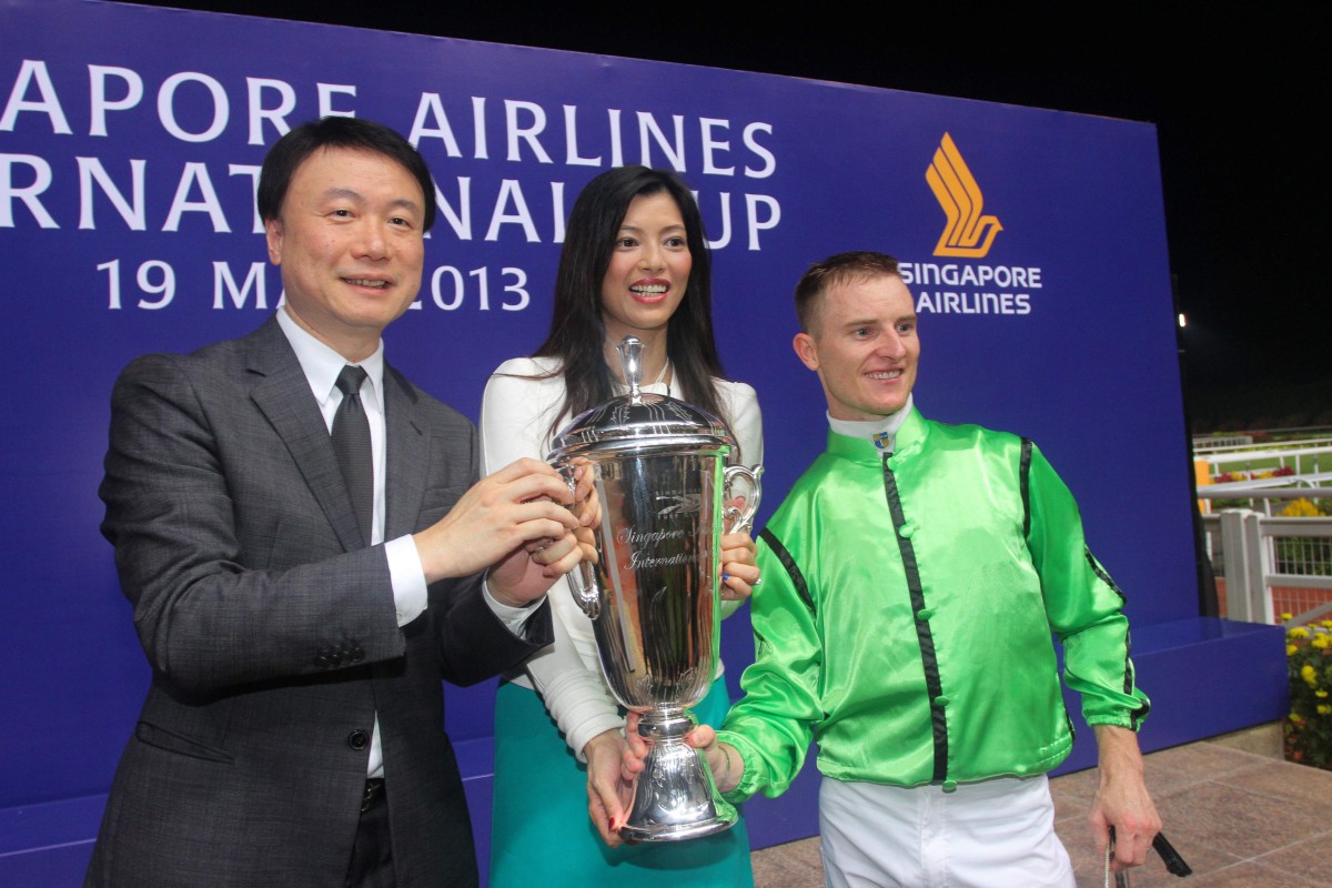 Steven Lo Kit-sing in happier times, after he won the Singapore Airlines International Cup with Military Attack. Ownership of the horse has been transferred to his wife Canny Leung Chi-shan.