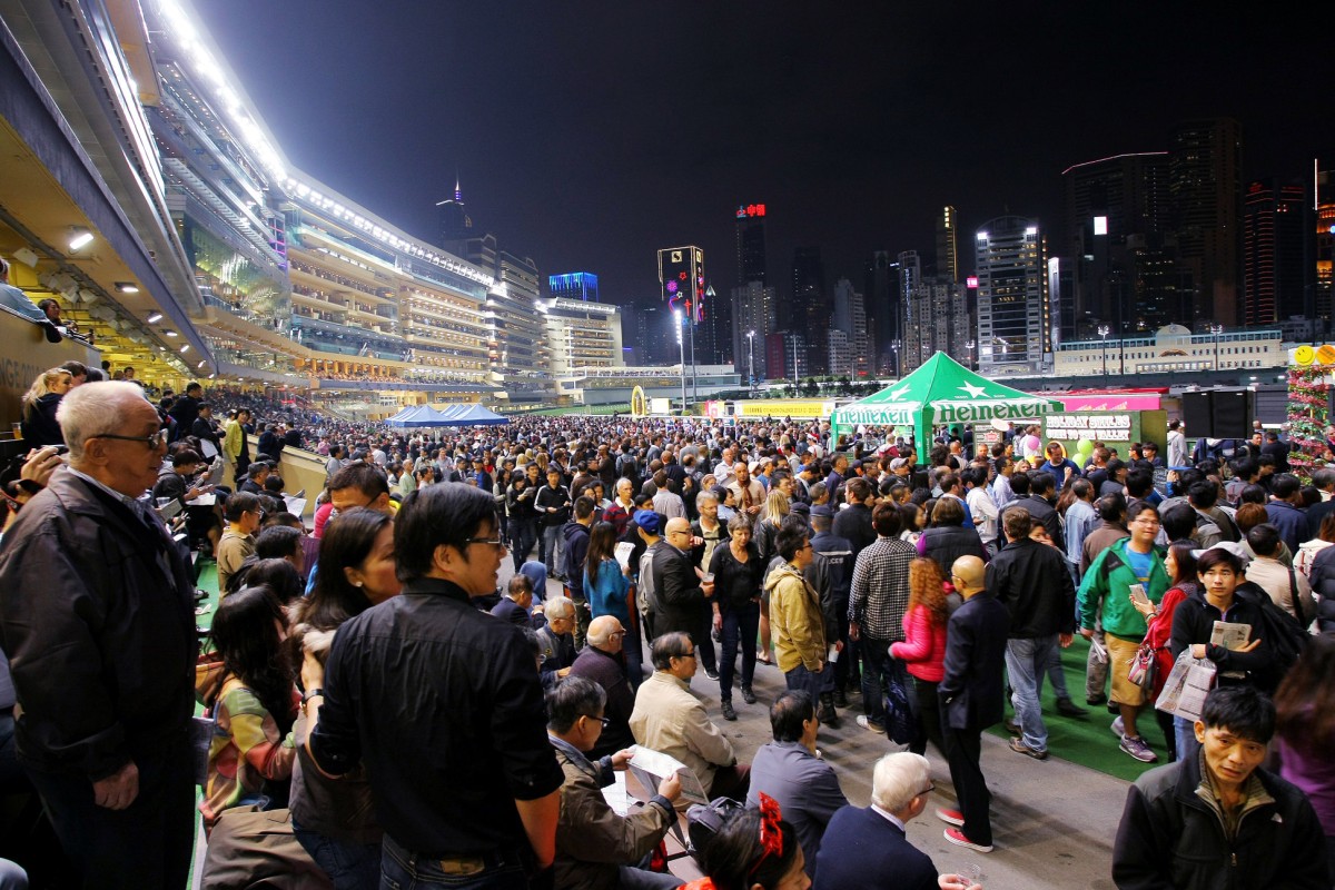 A packed Happy Valley crowd enjoys the beer garden. This sight won't be seen again until October. Photo: Kenneth Chan
