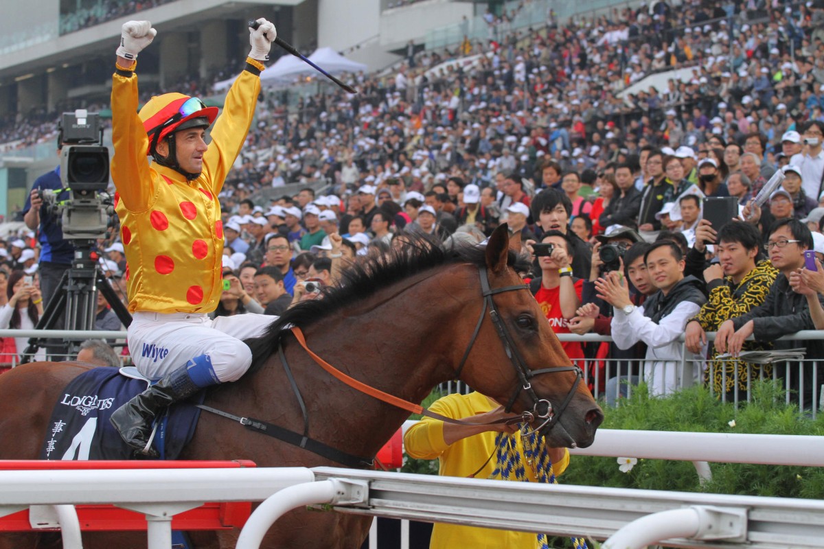 Douglas Whyte salutes after taking out December's Hong Kong Cup aboard Akeed Mofeed, the champion rider's first success in the race. Photo: Kenneth Chan