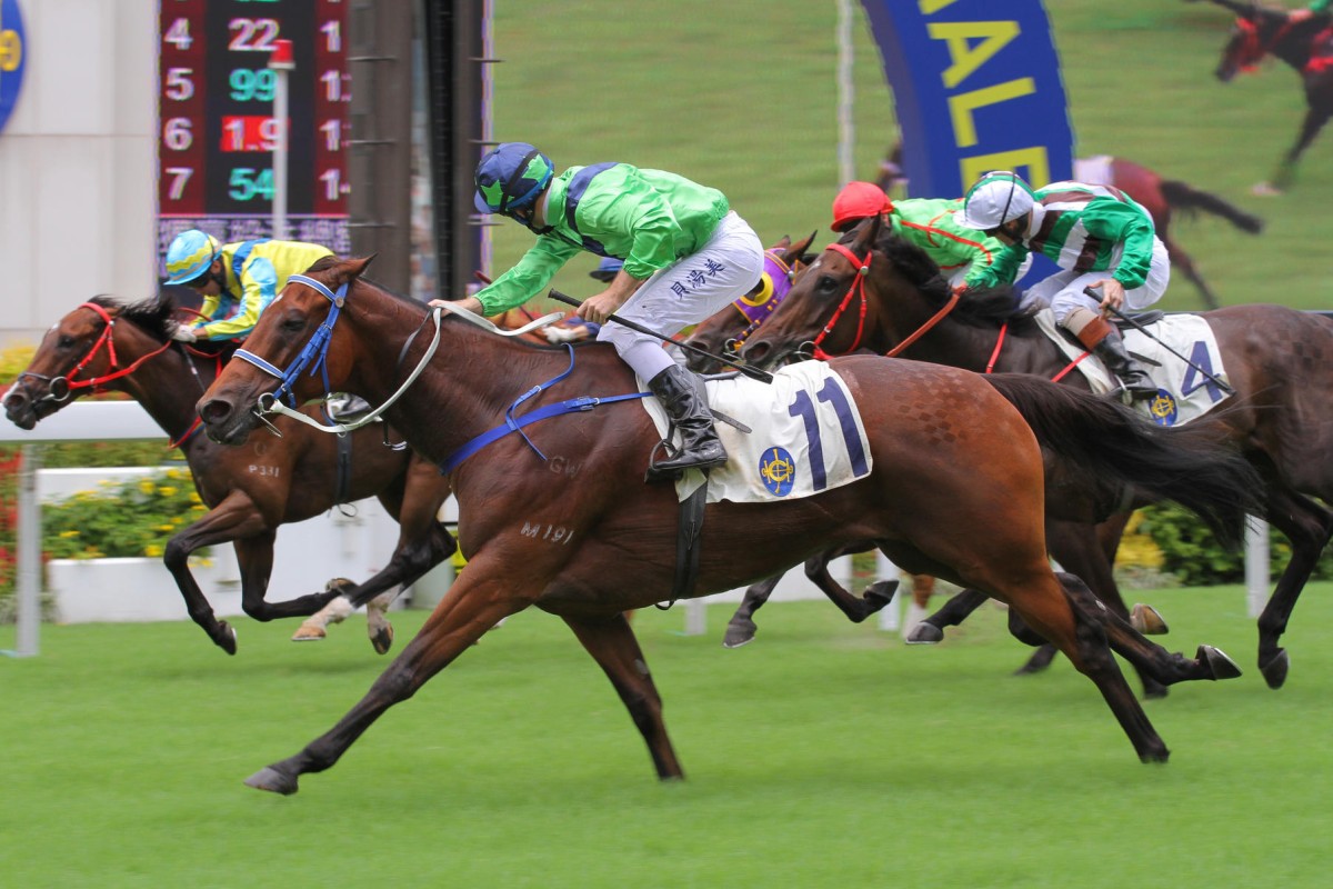 Tommy Berry looks to his inside after Flying Keeper chalked a win up for Caspar Fownes, drawing him level in the trainers' title. Photos: Kenneth Chan