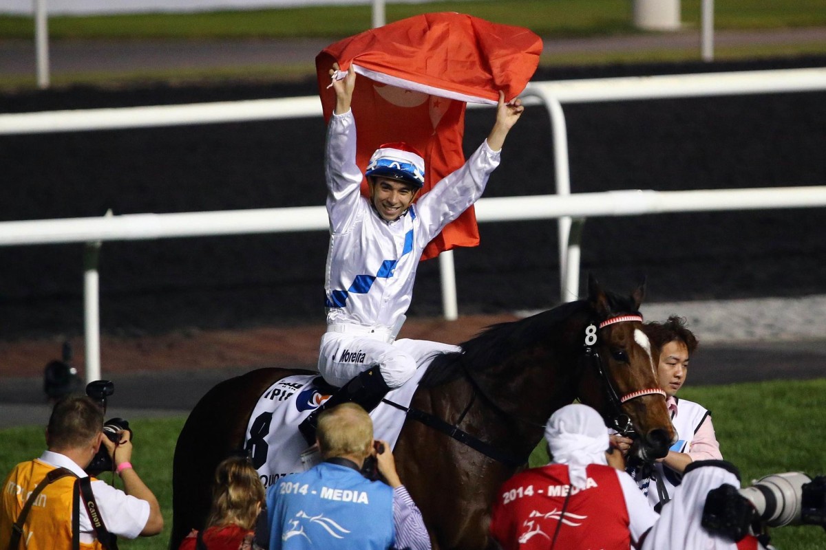 Joao Moreira flies the Hong Kong flag after winning the Al Quoz Sprint in Dubai aboard Amber Sky. The pair reunite for today's National Day Cup as the speedster eyes bigger riches.Photos: AFP/Kenneth Chan