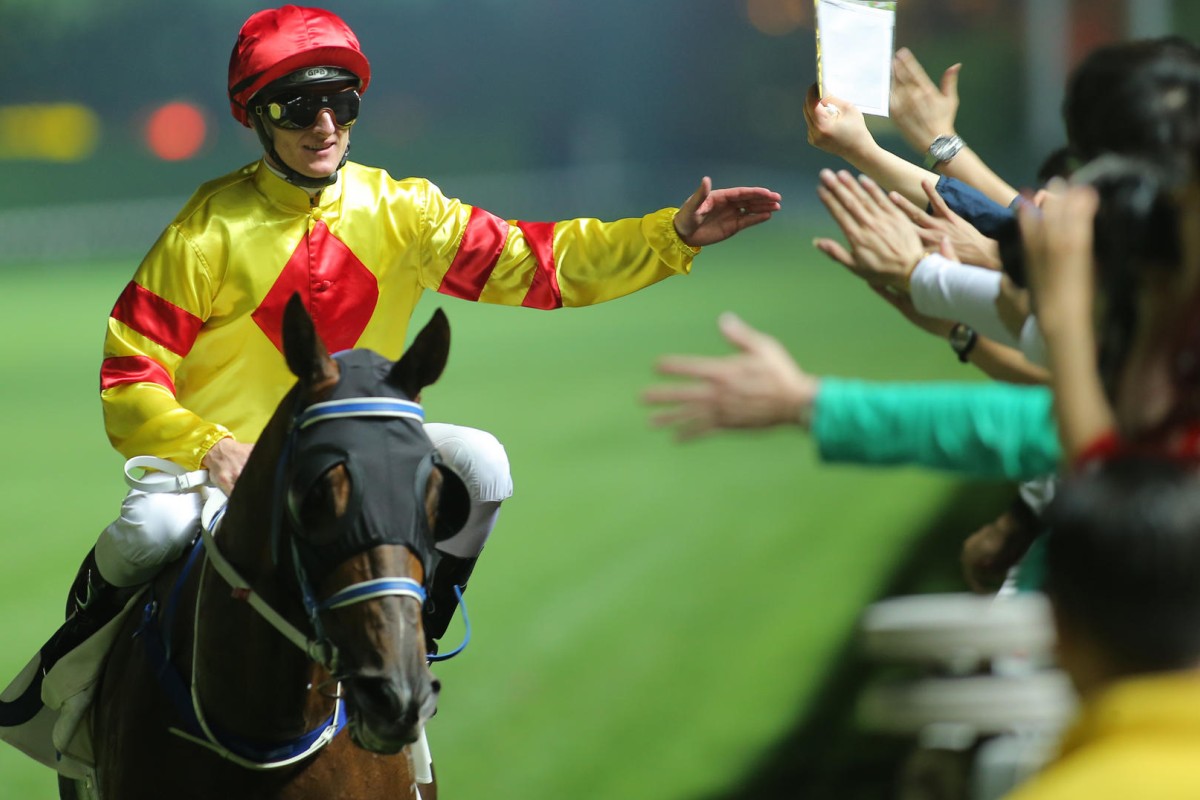 Zac Purton, aboard Twin Delight, celebrates after securing the Million Challenge for Caspar Fownes on Wednesday night. Photos: Kenneth Chan