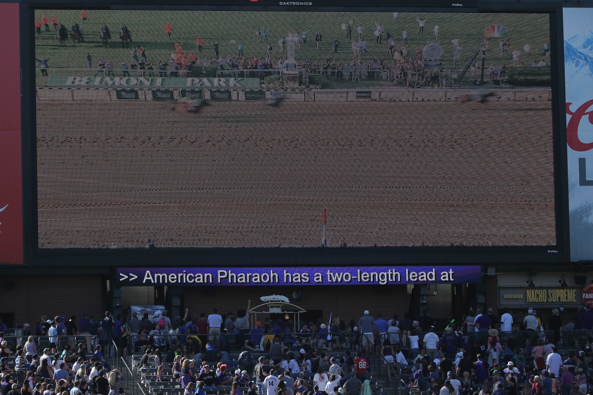 American Pharoah's quest for the Triple Crown thrust racing into the spotlight. Here, it was shown in between innings at a Major League Baseball game in Denver, Colorado. Photo: AFP
