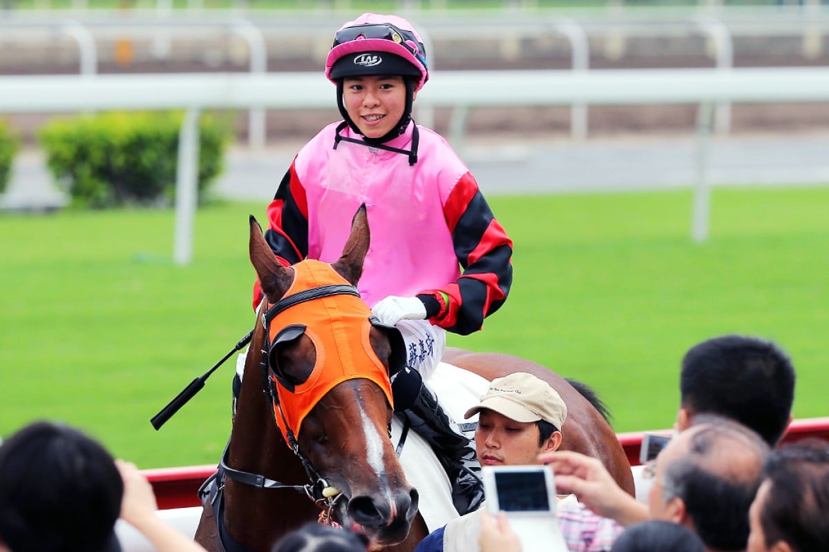 Kei Chiong returns to the cheers of the Sha Tin crowd after recording her first winner on Hearts Keeper. Photo: Kenneth Chan
