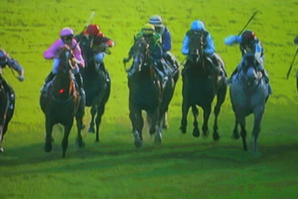 A freeze-frame sequence of Joao Moreira losing his whip from his right hand, before catching it in his left. Click right to view the sequence. Photo: Kenneth Chan