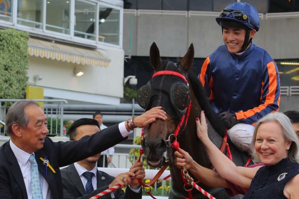 Ronald Arculli and wife Johanna celebrate Red Dancer’s victory with jockey Keith Yeung. Photo: Kenneth Chan