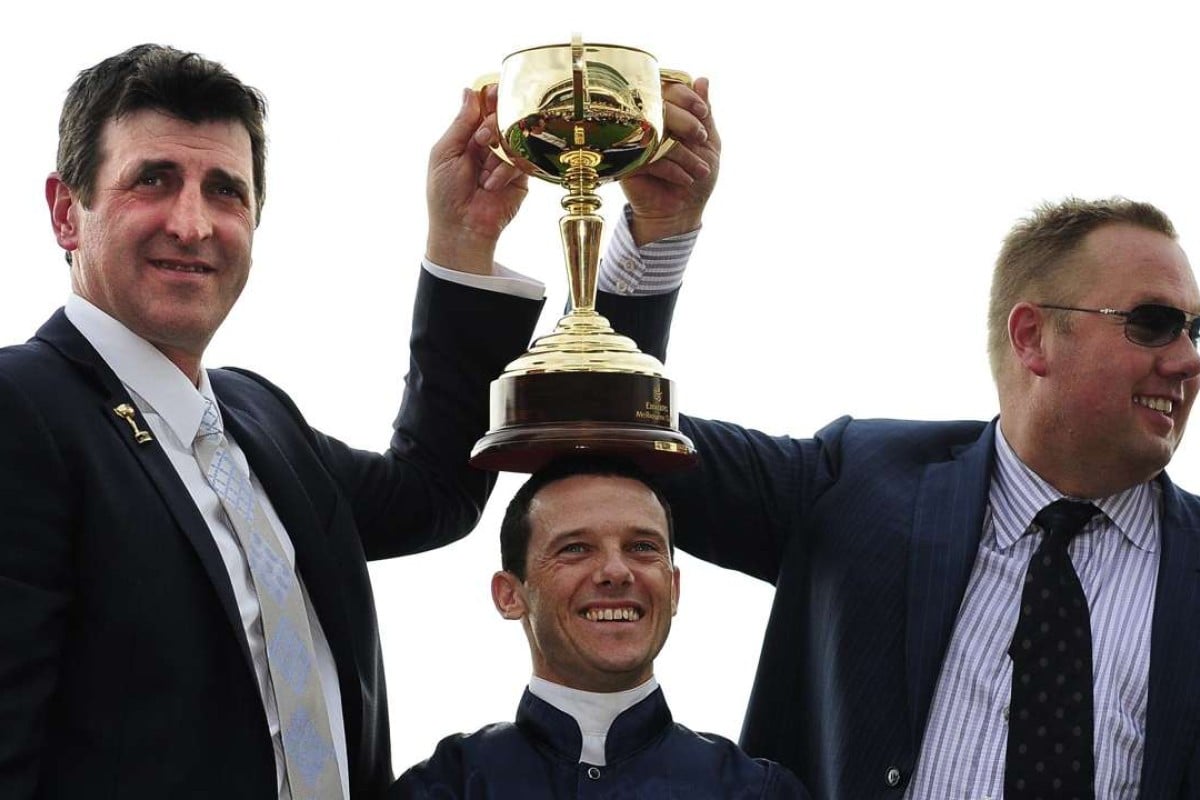 Trainer Robert Hickmott, jockey Brett Prebble and owner Nick Williams celebrate after Green Moon’s Melbourne Cup win in 2012. Photos: EPA/JULIAN SMITH