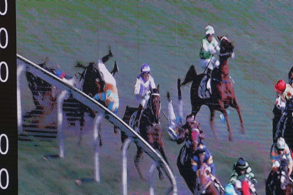 Umberto Rispoli and Jack Wong hit the deck after a scary fall at Happy Valley on Wednesday night.