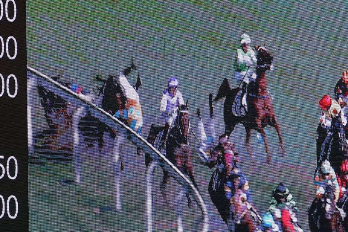 Umberto Rispoli (Mr Pele) and Jack Wong (Dashing King) tangle in a nasty tumble at Happy Valley.