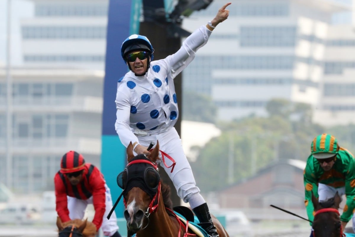 Brett Prebble salutes as Contentment wins the Group One Champions Mile. Photos: Kenneth Chan