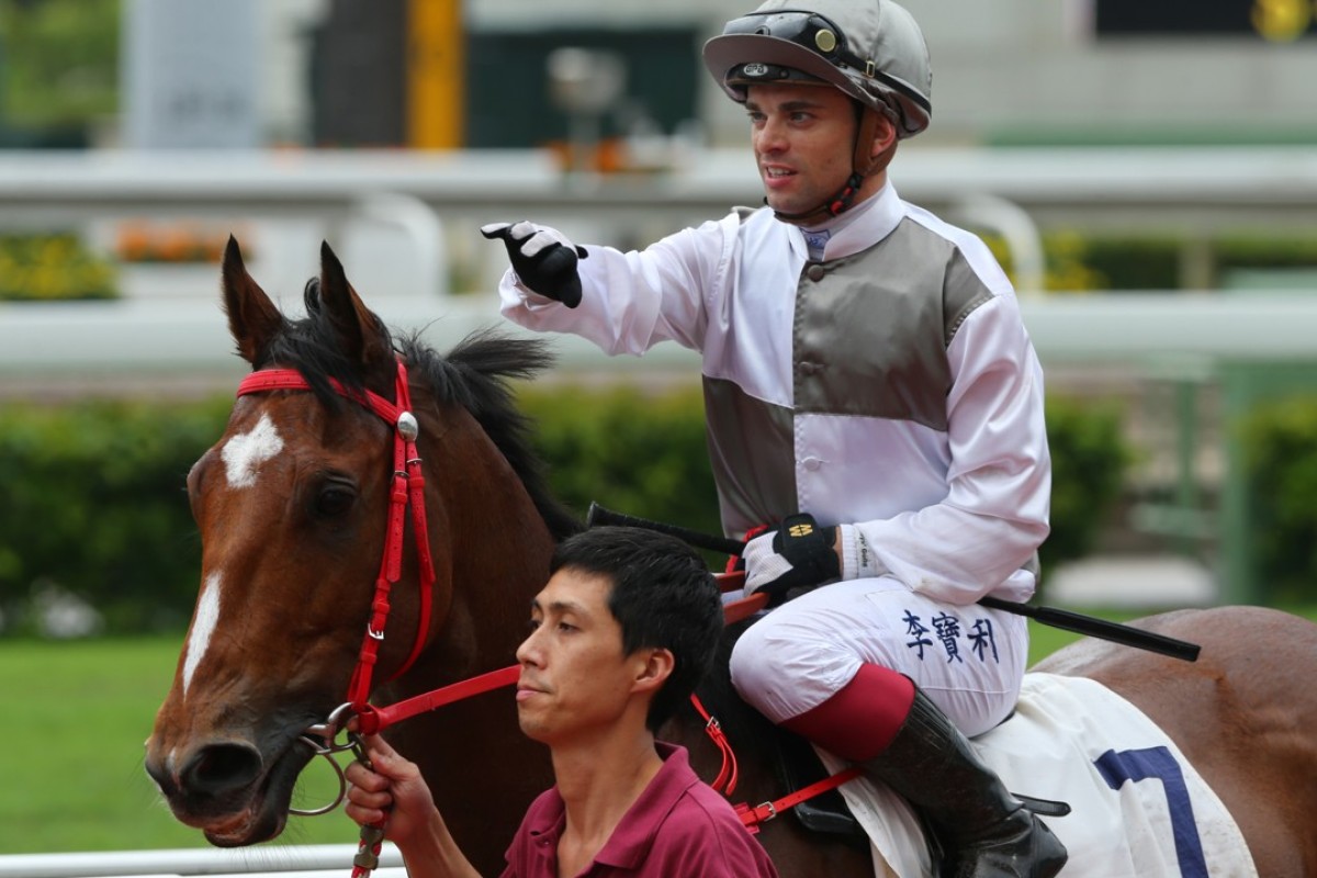 Umberto Rispoli gives Ivictory a pat after his debut win. Photos: Kenneth Chan