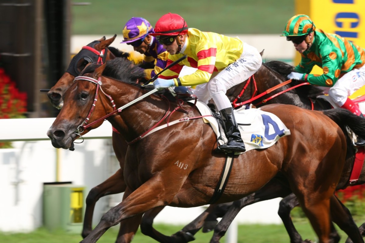 Sam Clipperton guides Booming Delight to victory in the Group Three Lion Rock Trophy. Photos: Kenneth Chan