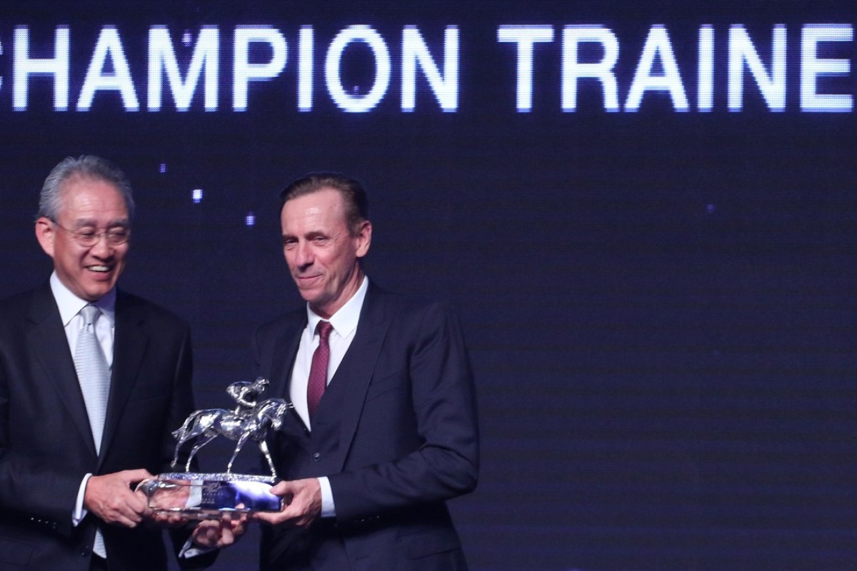 John Size collects his Champion Trainer trophy for the 2016-17 season. Photos: Kenneth Chan
