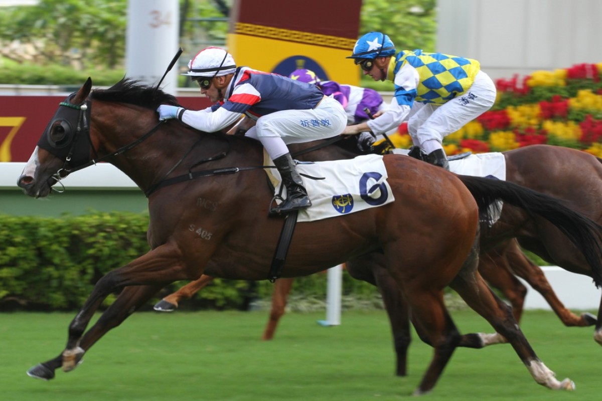 Sam Clipperton drives home Bossiee to win at Sha Tin on Sunday. Photos: Kenneth Chan