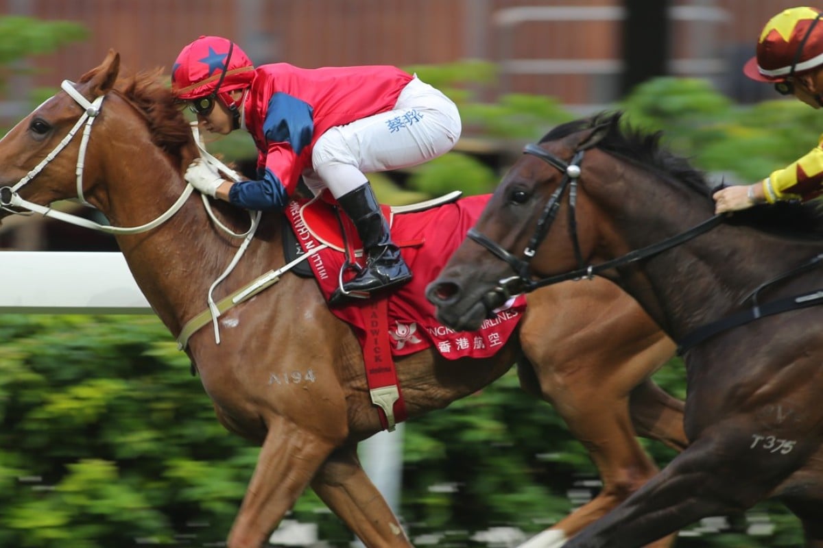 Matthew Chadwick guides The Golden Age to victory at Happy Valley on Sunday. Photos: Kenneth Chan