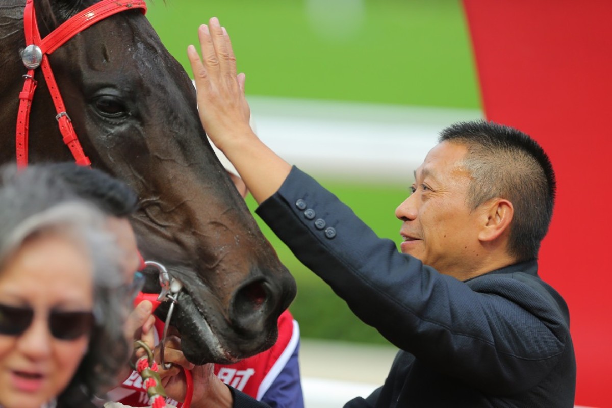 Danny Shum gives Seasons Bloom at pat after winning the Group Two Jockey Club Mile. Photos: Kenneth Chan