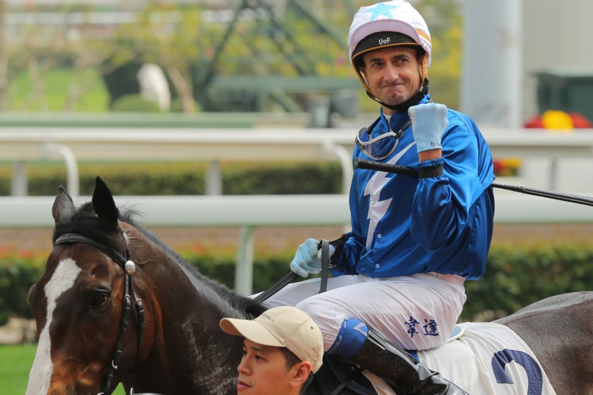 Douglas Whyte celebrates his win aboard Iron Boy on Saturday. Photos: Kenneth Chan