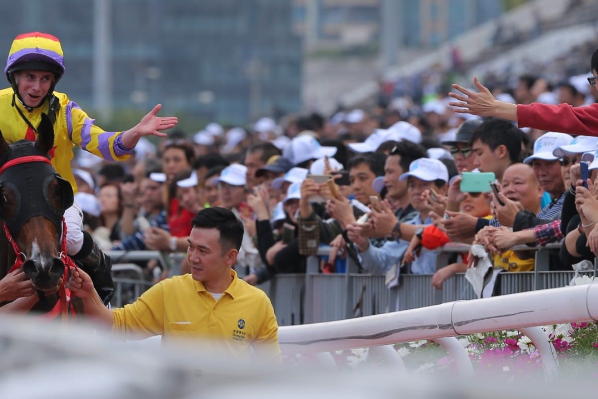 Ryan Moore interacts with a fan after winning the BMW Hong Kong Derby. Photos: Kenneth Chan