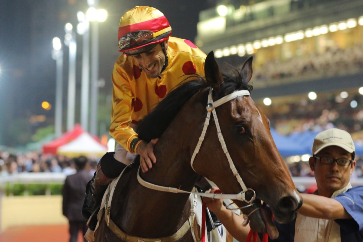 Alberto Sanna gives Gold Mount a pat after winning the Class One Hong Kong Vase on Wednesday night. Photo: Kenneth Chan