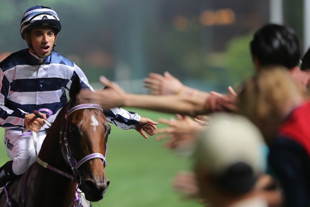Joao Moreira celebrates Eighty Eighty’s win with the fans. Photos: Kenneth Chan