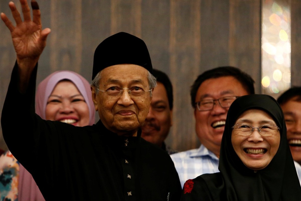 Malaysia’s newly elected Prime Minister Mahathir Mohamad with Wan Azizah, the wife of Anwar Ibrahim. Photo: Reuters