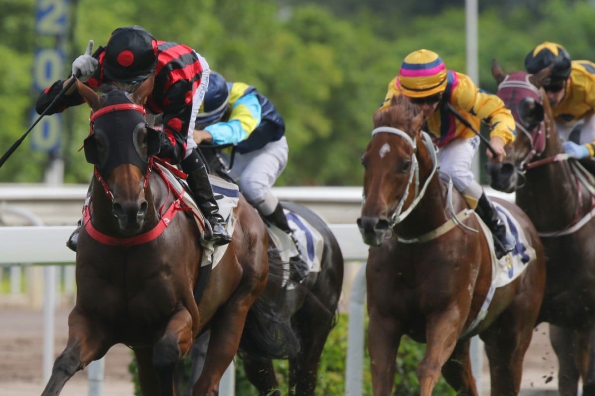 Joao Moreira salutes as Thewizardofoz wins the Premier Cup in June. Photos: Kenneth Chan