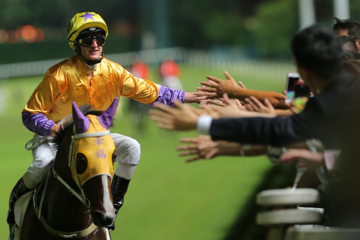 Zac Purton celebrates Doctor Geoff’s victory on Wednesday night. Photo: Kenneth Chan