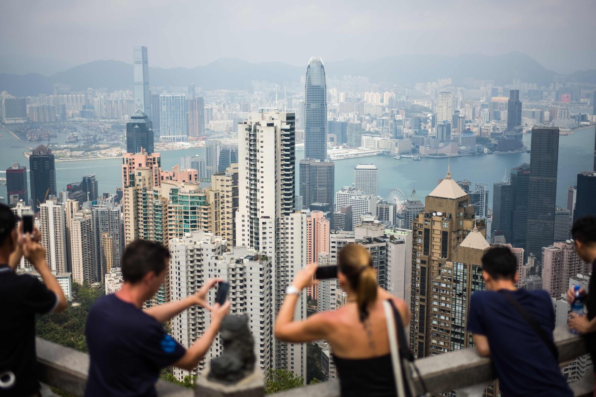 Tourists take photos from Hong Kong's Victoria Peak. Photo: AFP